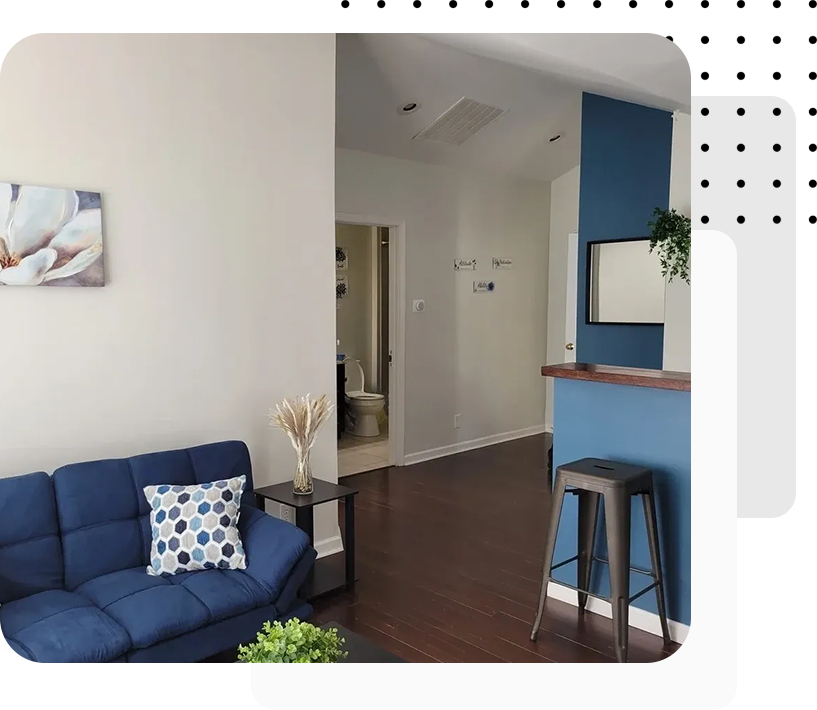 A living room with blue walls and furniture.